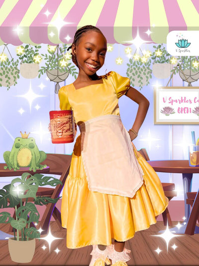 Kid girl wearing yellow pleated princess tiana waitress dress with aipron and puff sleeve, Lily pad Princess the frog deluxe waitress dress for girls kids and toddlers