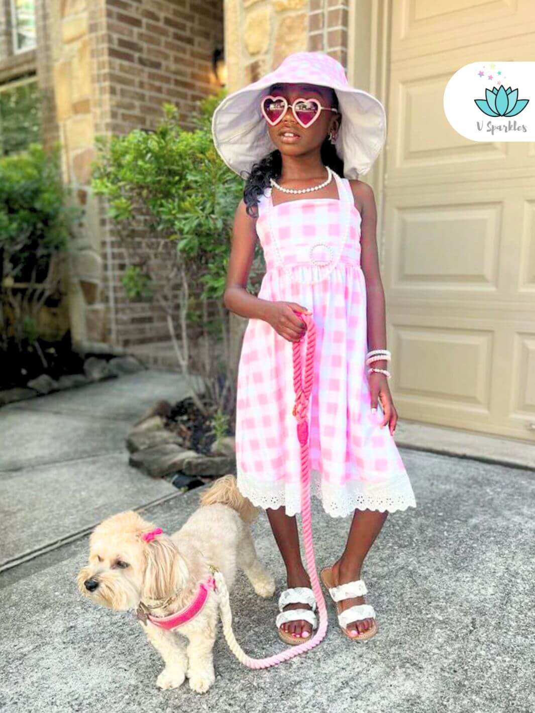 "Chic Barbie costume for kids in a pink gingham pattern, great for any Disneybound adventure, birthday party, or Halloween event. A fashionable self-treat or thoughtful gift.