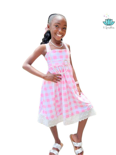 "Kids' Barbie dress with adorable gingham design, perfect for dress-up games, play pretend, or as a fun Disneybounding outfit. Great for Halloween or birthday celebrations.