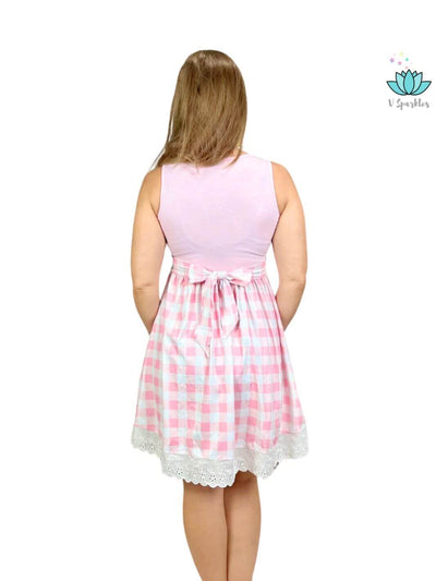 "Barbie pink gingham dress, perfect for Disneybounding adventures or as a stylish birthday dress. A must-have self-treat for adults who love playful fashion.