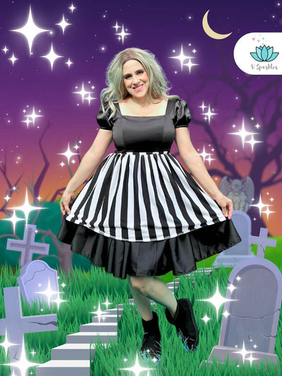 Mischievous Ghost Dress-Up Overskirt for Women – Beetlejuice-Inspired Disneybounding Accessory – This bold black-and-white striped overskirt is perfect for transforming into a mischievous ghost, inspired by Beetlejuice. Ideal for Disneybounding, Halloween costumes, or themed events. Available in mid-size and plus-size options.