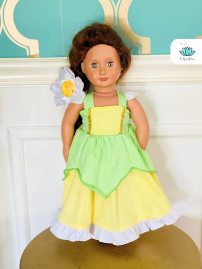 "Tiana doll dress featuring a lily pad design, great for Disneybounding outfits or as a magical addition to any dress-up game. Perfect for Halloween costumes or birthday celebrations.