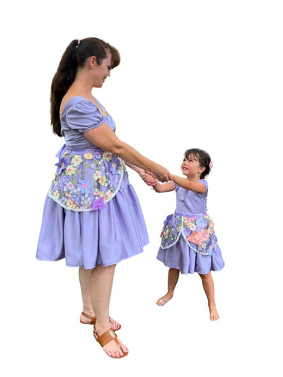 Floral Fairytale Dress-Up Overskirt for Kids – Matching Mother and Daughter Outfit – Create a magical matching mother and daughter Disneybounding look with this Rapunzel-inspired floral overskirt for kids. Perfect for toddler girls for Halloween costumes or special occasions.

