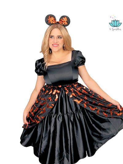 Black Dress with Black and Orange Overskirt – Perfect for Halloween and Disneybounding – Channel your inner bat with this black dress paired with a dramatic black and orange overskirt, ideal for Halloween parties, Disneybounding, or special occasions. Available in mid-size and plus-size options.